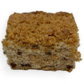 Slice of gluten-free banana chocolate chip coffee cake showing soft crumb and chocolate chips