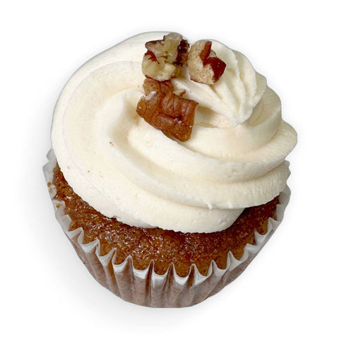 gluten free carrot cupcake with dairy free vanilla cream cheese buttercream and walnuts