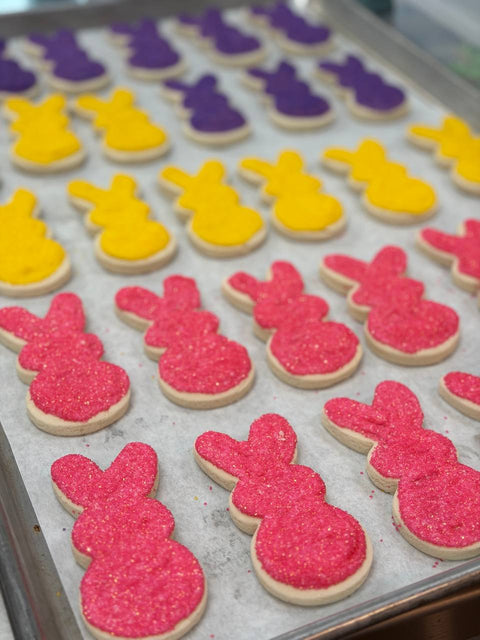 Gluten-free and vegan Easter bunny sugar cookies decorated with colorful sugar in pink, yellow, and purple at Sinful Confections Portland
