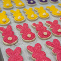 Decorated gluten-free and vegan Easter bunny sugar cookies with icing tails and colored sugar at Sinful Confections Portland bakery