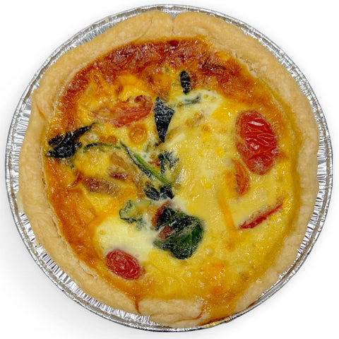 Gluten-free farmstand bacon quiche with tomatoes, caramelized onions, and basil