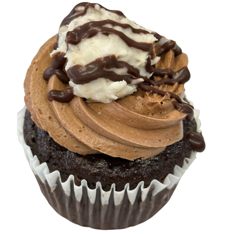 gluten free german chocolate cupcake with dairy free coconut almond frosting and chocolate drizzle