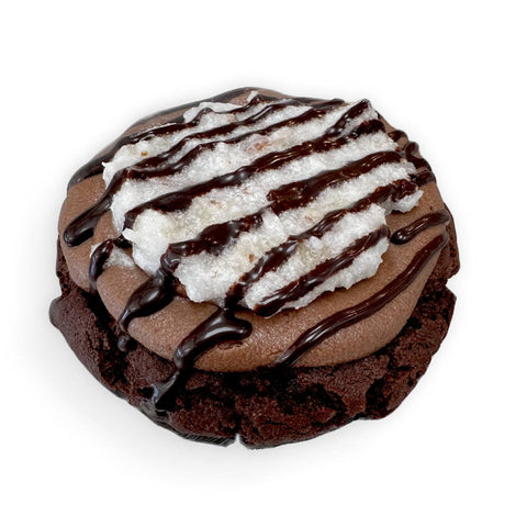 German chocolate loaded cookie with coconut almond topping and chocolate ganache drizzle