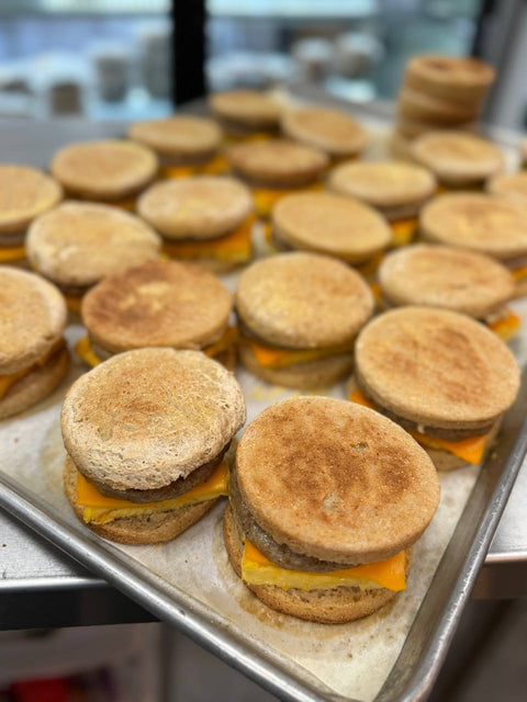 Plate of gluten-free sausage egg and cheese sandwiches with dairy-free cheese