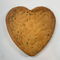 Plain heart-shaped gluten-free cookie cake with chocolate chips, unfrosted and baked fresh by Sinful Confections in Portland, Oregon.