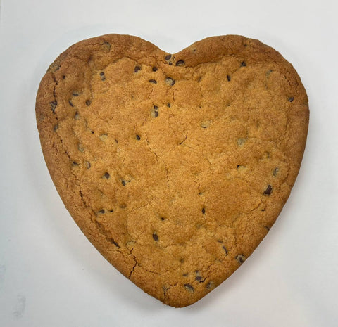 Plain heart-shaped gluten-free cookie cake with chocolate chips, unfrosted and baked fresh by Sinful Confections in Portland, Oregon.