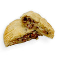 Gluten-free jalapeño popper hand pie from Sinful Confections bakery filled with creamy cheese, bacon, and jalapeños in a flaky crust