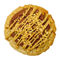 Peanut butter chocolate royale loaded cookie with chocolate buttercream and peanut butter drizzle