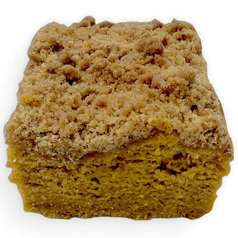 Side angle of our pumpkin spice coffee cake showing the soft crumb and crumble topping, gluten free, dairy free and vegan.