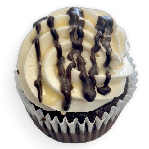 gluten free salted caramel cupcake with dairy free vanilla buttercream, caramel drizzle and sea salt