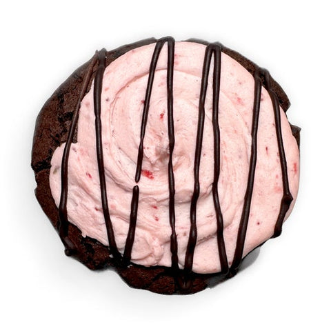 Strawberry lava loaded cookie with strawberry buttercream and chocolate drizzle