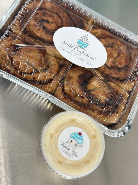 Gluten free dairy free Take N Bake cinnamon rolls in tray with side icing container