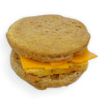 Gluten-free vegan bacon egg and cheese breakfast sandwich from Sinful Confections bakery with vegan bacon, vegan egg, and dairy-free cheddar-style cheese
